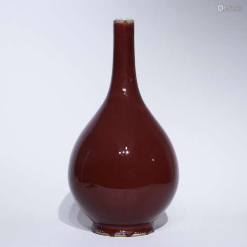 A red glazed vase