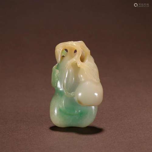 A Rare Carved Jadeite Gourd Pendant