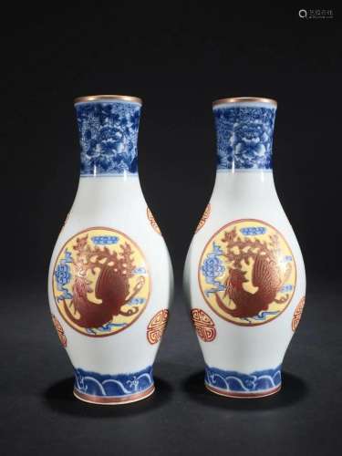 A Pair of Blue and White Painted Gold Olive Vases