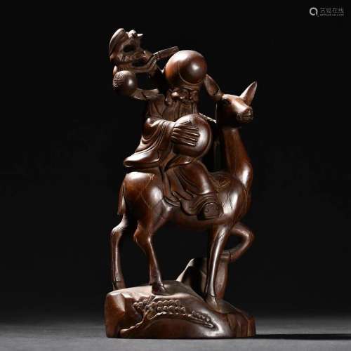 A Fine Carved Huangyang Wood 'Shou Xing' Ornament