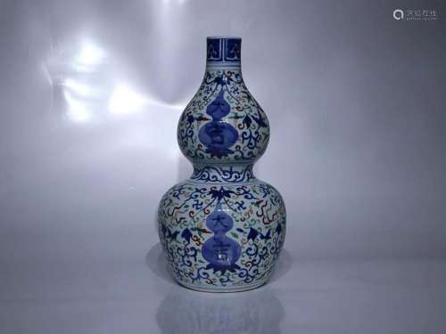 CHINESE BLUE-AND-WHITE AND FAMILLE-VERTE DOUBLE-GOURD VASE, ...