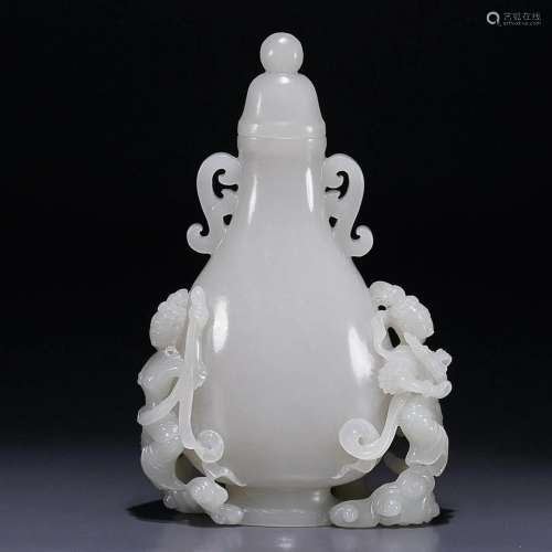 CHINESE HETIAN JADE HANDLED VASE WITH CARVED 'FIGURE'...