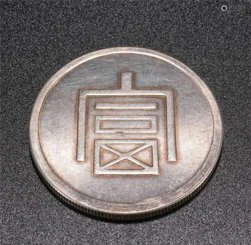 A SILVER COIN