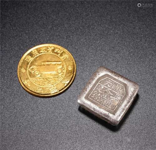 A GROUP OF COIN AND INGOT