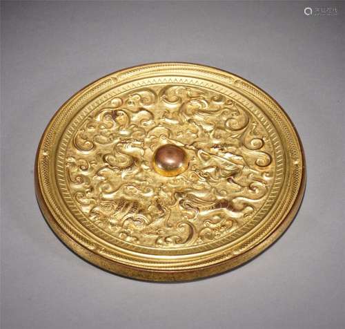 A GILT BRONZE MIRROR