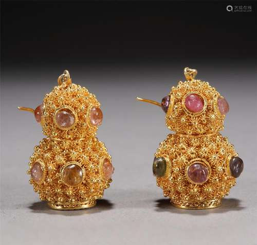 A PAIR OF GILDING ORNAMENTS