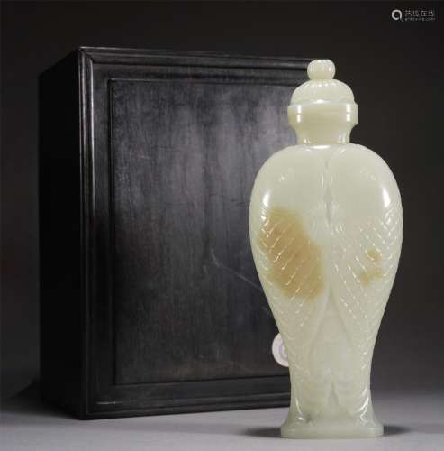 A WHITE JADE CARVED DOUBLE FISH VIEWS VASE