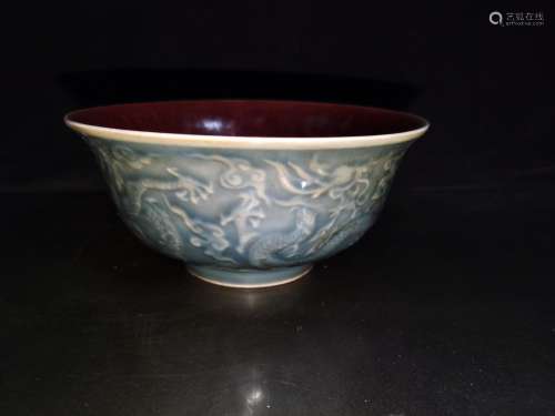 A pair of, high-relief dragon bowl