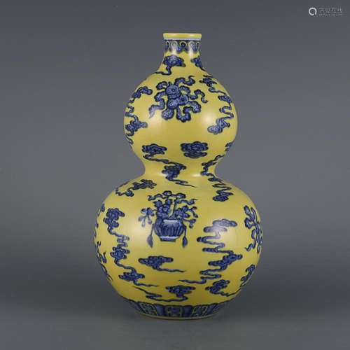 CHINESE YELLOW-GROUND BLUE-AND-WHITE DOUBLE-GOURD VASE DEPIC...