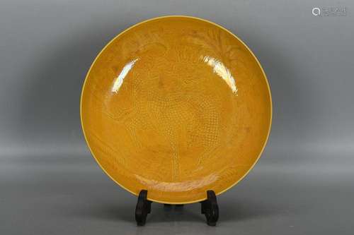 CHINESE YELLOW-GLAZED CHARGER DEPICTING 'QILIN', ...