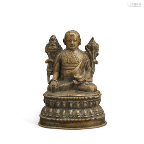西藏 十四至十五世纪 铜错银喇嘛坐像