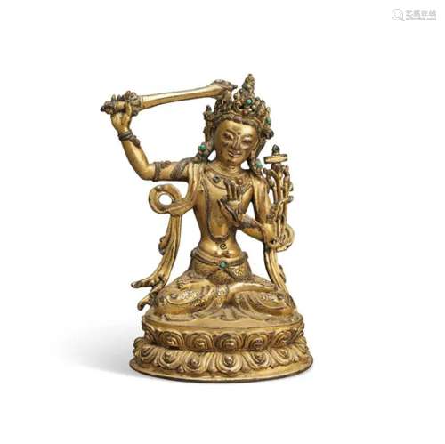 西藏 十五至十六世纪 鎏金铜文殊菩萨坐像