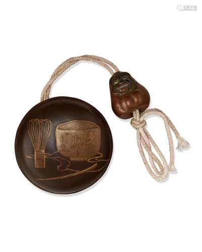 EDO PERIOD (19TH CENTURY) A LACQUER MANJU-NETSUKE WITH METAL...