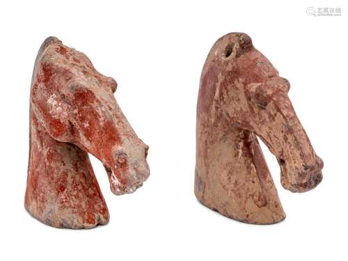 Two Chinese Red Glazed Pottery Horse Heads