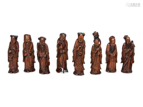 Eight Chinese Carved Hardwood Figures of the Daoist Immortal...