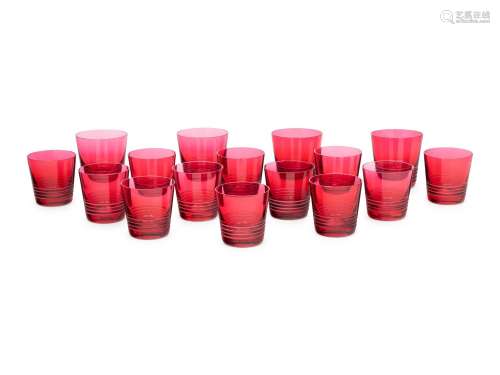 A Set of Sixteen Hermès Attelage Pink Glass Tumblers