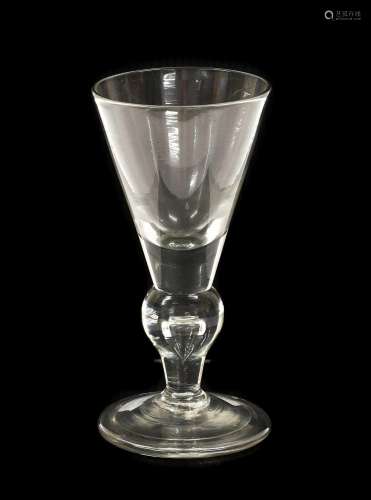 A Heavy Baluster Wine Glass, circa 1710, the conical bowl wi...