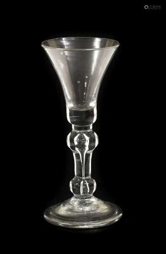 A Wine Glass, circa 1730, the bell-shaped bowl on inverted b...