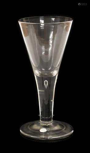 A Glass Goblet, circa 1740, the drawn trumpet bowl on a plai...