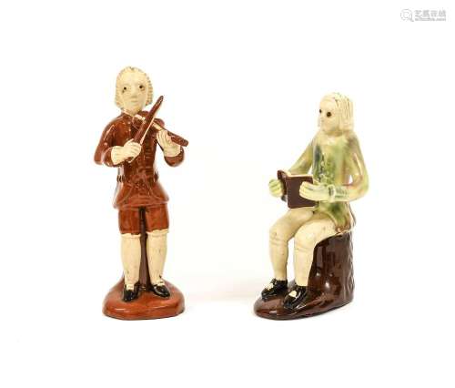 An Astbury-Whieldon-Type Creamware Figure of a Musician, pro...