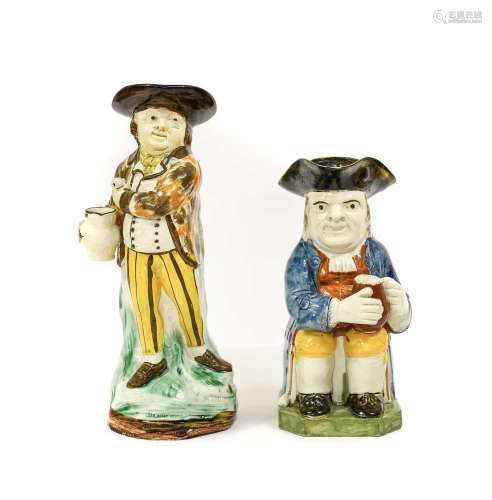 A Prattware Hearty Goodfellow Toby Jug, circa 1800, the stan...