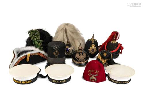 A Collection of Twenty-One Military Parade Helmets, Hats and...