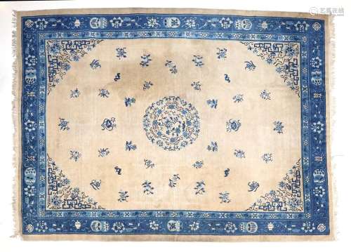 Chinese Carpet, circa 1900The cream field sparsely decorated...
