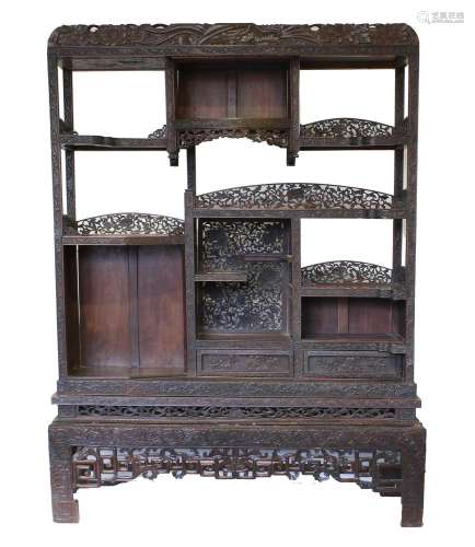 A Chinese Carved Hardwood Display Cabinet, late 19th/early 2...