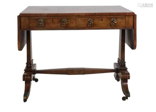 A Regency Rosewood Sofa Table, early 19th century, with roun...