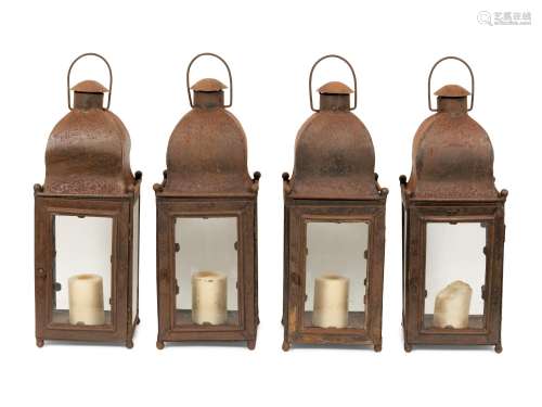A Set of Four Weathered Steel Lanterns