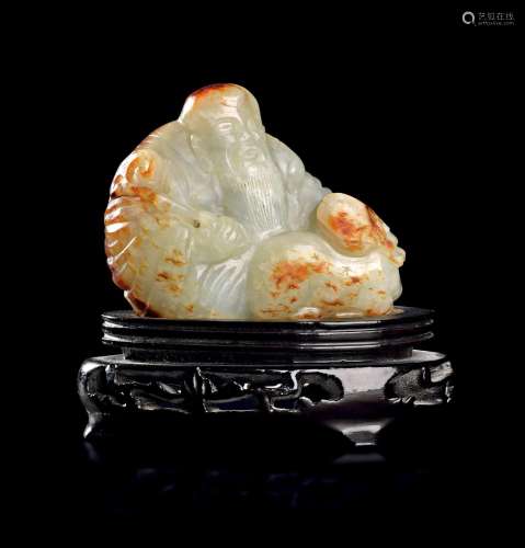 A CHINESE CELADON AND RUSSET JADE CARVING OF A SAGE AND HARE...