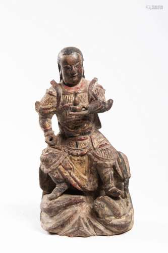 A CHINESE POLYCHROMED CARVED WOOD FIGURE OF A SEATED DIGNITA...
