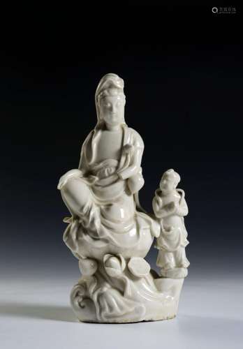 A CHINESE DEHUA PORCELAIN FIGURE OF GUANYIN WITH AN ACOLYTE ...
