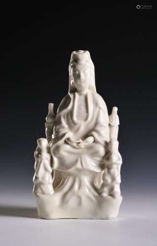 A CHINESE DEHUA PORCELAIN FIGURE OF GUANYIN WITH TWO ACOLYTE...