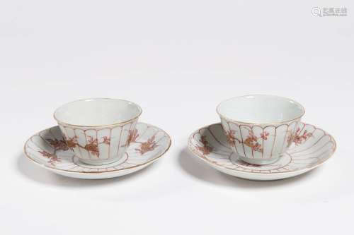 A PAIR OF CHINESE FAMILLE-ROSE PORCELAIN TEACUPS WITH SAUCER...