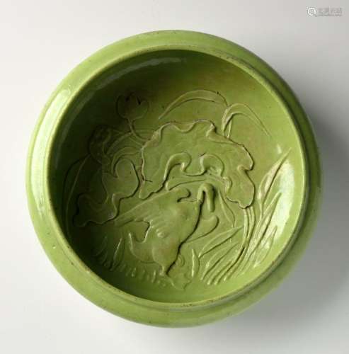 A CHINESE PALE LIME-GREEN-GLAZED CARVED BRUSHWASHER 清代绿釉...