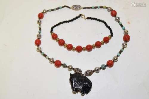 Two Chinese Cinnabar Carved Bead Necklaces