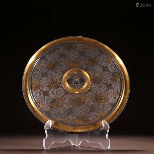 In ancient China, bronze mirrors with gold and silver phoeni...