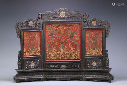 In the Qing Dynasty, red sandalwood hollowed-out lacquer-pai...