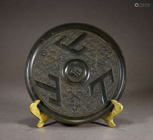 In ancient China, the bronze mirror with the shape of a moun...