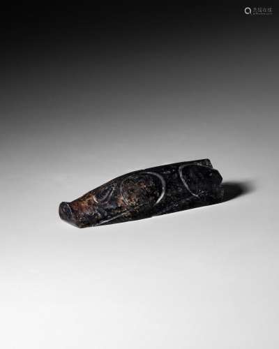 AN ARCHAIC BLACK JADE CARVING OF A PIG Han Dynasty