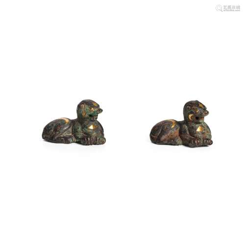 A PAIR OF INLAID AND GILDED BRONZE TIGER WEIGHTS Han dynasty