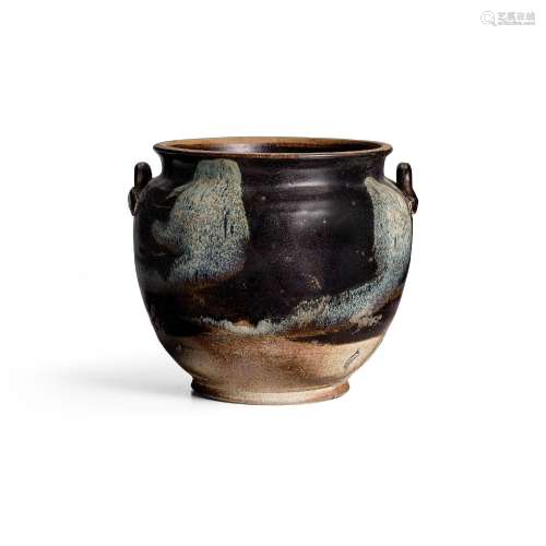 A 'PHOSPHATIC' GLAZED JAR WITH LUG HANDLES Tang dynasty