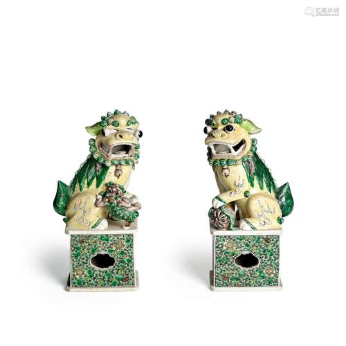 A PAIR OF SANCAI-GLAZED BISCUIT LIONS Late Qing dynasty