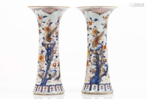 A pair of large Imari beaker vases