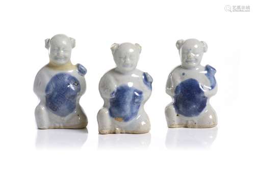 A set of three boys figures