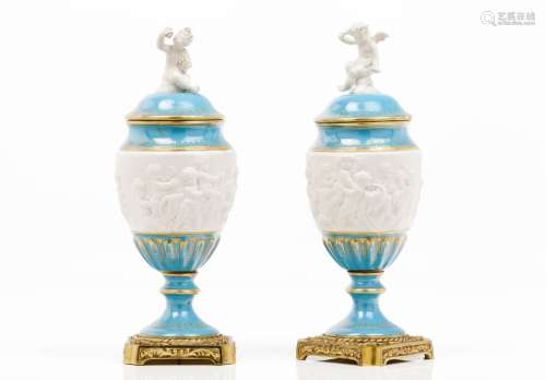 A pair of urns with covers