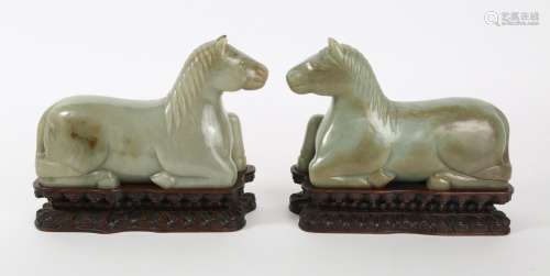 Pair of Chinese Carved Celadon Jade Horses with fitted stand...