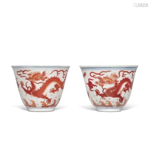 A pair of iron-red 'dragon' cups, Seal marks and period of Q...