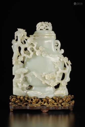 A large white jade 'prunus and lingzhi' vase and cover, Qing...